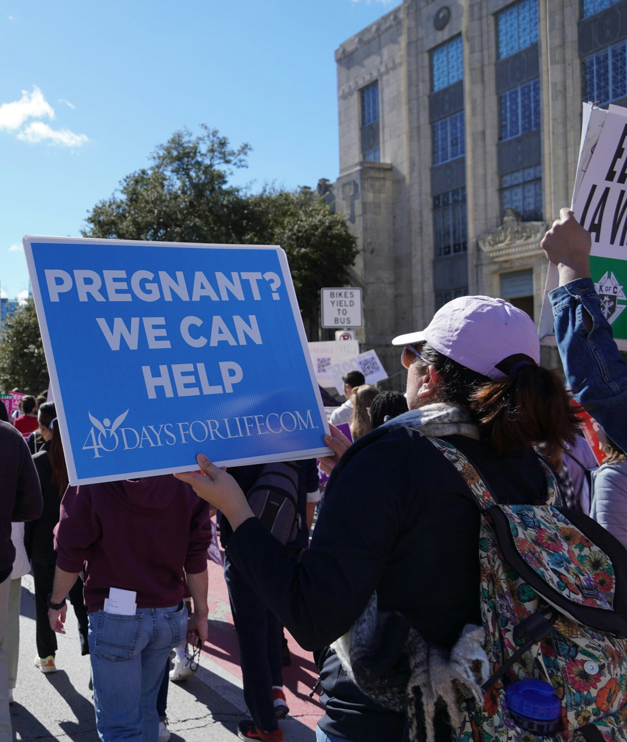 Photo of 40 Days for Life procession and sign  by Elyssa DeDios on Unsplash.
      